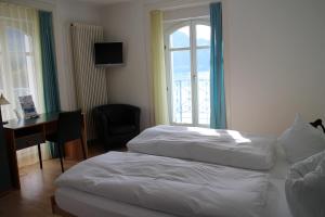Postel nebo postele na pokoji v ubytování Seminar-Hotel Rigi am See