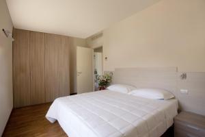 Кровать или кровати в номере Residence Le Querce