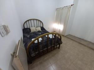 Ένα ή περισσότερα κρεβάτια σε δωμάτιο στο Casa de descanso