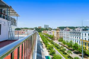 a view of a city from a balcony at The Enchanted Ha Long Hotel in Ha Long +42 photos
