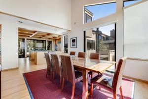 a dining room with a wooden table and chairs at The Indigo in Sea Ranch