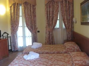 Letto o letti in una camera di Albergo Giardino