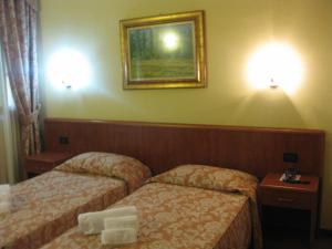 Letto o letti in una camera di Albergo Giardino
