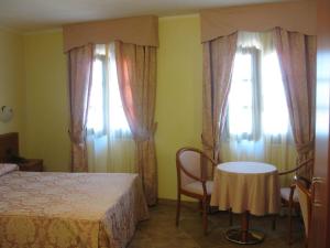 Letto o letti in una camera di Albergo Giardino