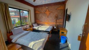 A bed or beds in a room at Hotel Hakoniwa