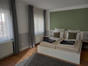 Ένα ή περισσότερα κρεβάτια σε δωμάτιο στο Ferienhaus Heiner und Walter