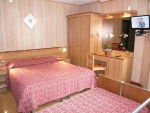 Postel nebo postele na pokoji v ubytování Albergo Panice