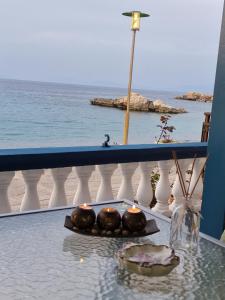 a view of the ocean from the balcony of a resort at Nereida (Νηρηίδα) Luxury Apartment in Kokkari