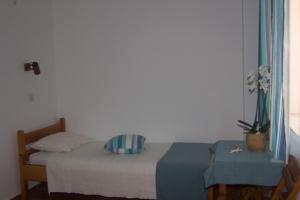 A bed or beds in a room at Medieval Rose Guest House