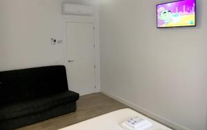 TV a/nebo společenská místnost v ubytování Casa Rural Doña Carmen