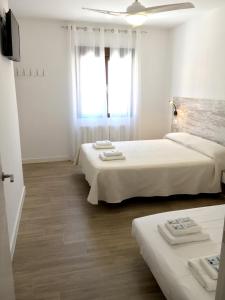 Postel nebo postele na pokoji v ubytování Casa Rural Doña Carmen