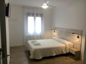 Postel nebo postele na pokoji v ubytování Casa Rural Doña Carmen