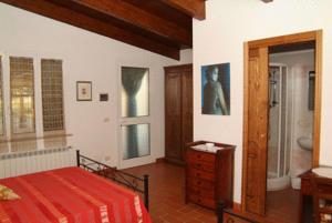 Postel nebo postele na pokoji v ubytování Agriturismo San Luigi