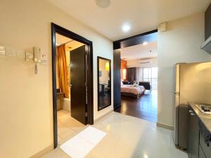 a room with a door leading to a bedroom at Sunway Resort Suites max 4 pax studio 1 mins walk to Sunway Pyramid in Petaling Jaya