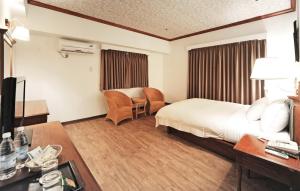 TV a/nebo společenská místnost v ubytování Kenting Holiday Hotel