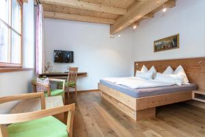 Łóżko lub łóżka w pokoju w obiekcie Brandstatthof Leogang