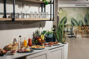 a table with plates of food on top of it at Amery House in Sliema