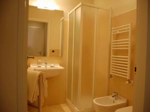 a bathroom with a sink and a toilet and a shower at Residenza il Nespolo - Estella Hotel Collection in Turin