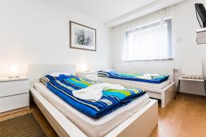 Katil atau katil-katil dalam bilik di Ferienhaus Köln