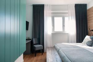 Postel nebo postele na pokoji v ubytování Guesthouse Frlan