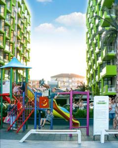 a group of children playing on a playground at Opium STUDIO ALEZZI in Mamaia Sat/Năvodari