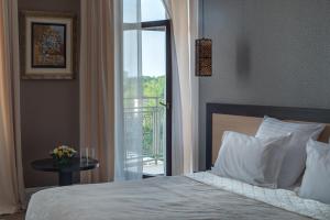 Postel nebo postele na pokoji v ubytování Ark Palace Hotel & SPA