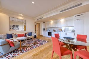 a living room with a couch and a table at Porto Montenegro Residences in Tivat