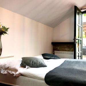 En eller flere senge i et værelse på Boutique Apartments Felicino údolí
