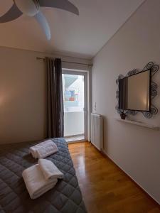 Posteľ alebo postele v izbe v ubytovaní Ageliki's Athens Apartment