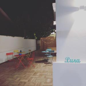 a group of tables and chairs on a patio at PURA B&b in Noicattaro