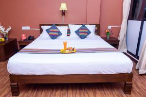 A bed or beds in a room at OYO 11468 Kathmandu Embassy Hotel