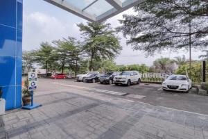 a parking lot with a bunch of cars parked at Vanez Mansion @Skylounge Tamansari in Parungkuda