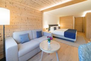 Rúm í herbergi á Gstaaderhof - Active & Relax Hotel