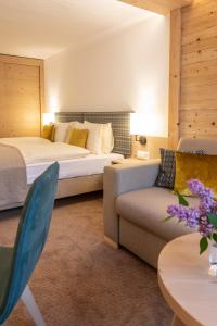 Rúm í herbergi á Gstaaderhof - Active & Relax Hotel