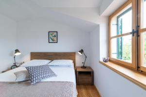Postel nebo postele na pokoji v ubytování Komun Apartments