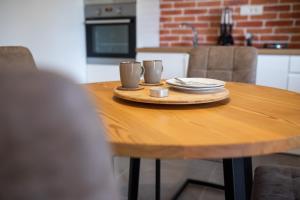 Kuchyň nebo kuchyňský kout v ubytování Komun Apartments