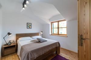 Postel nebo postele na pokoji v ubytování Komun Apartments