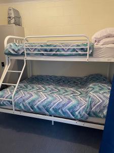 a couple of bunk beds in a room at Peter's Port in Pine Point