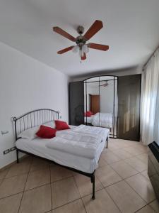 a bedroom with a bed with a ceiling fan at Marzan 12 in Peschiera del Garda