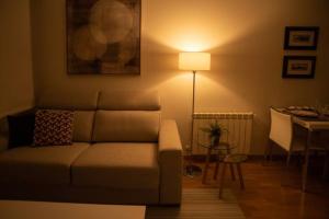 a living room with a couch and a table at Urzaiz Centro Vigo in Vigo