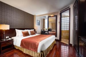 Postel nebo postele na pokoji v ubytování TK123 Hanoi Hotel