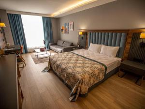 Ένα ή περισσότερα κρεβάτια σε δωμάτιο στο İncipark Hotel