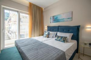 Postel nebo postele na pokoji v ubytování Alcmene Lux Apartment by "elite"