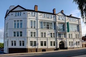 a large white building with a large window at Best Western Stoke on Trent City Centre Hotel in Stoke on Trent