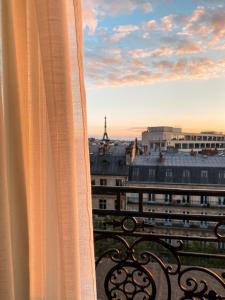 a view of the eiffel tower from a window at Hyatt Paris Madeleine in Paris