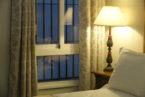 Postel nebo postele na pokoji v ubytování Vivienda Turistica Santa Maria de la Sierra