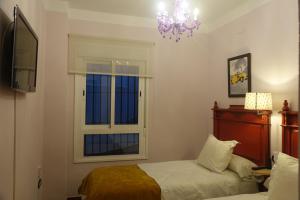 Postel nebo postele na pokoji v ubytování Vivienda Turistica Santa Maria de la Sierra + 5 fotografií