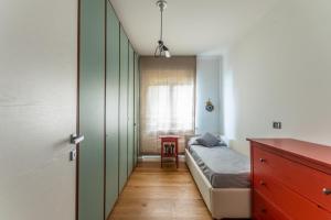 Ένα ή περισσότερα κρεβάτια σε δωμάτιο στο Oltre House