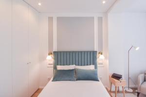 Säng eller sängar i ett rum på Oporto lovely house deluxe