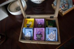 a box of different colored books on a table at Dromard House in Enniskillen